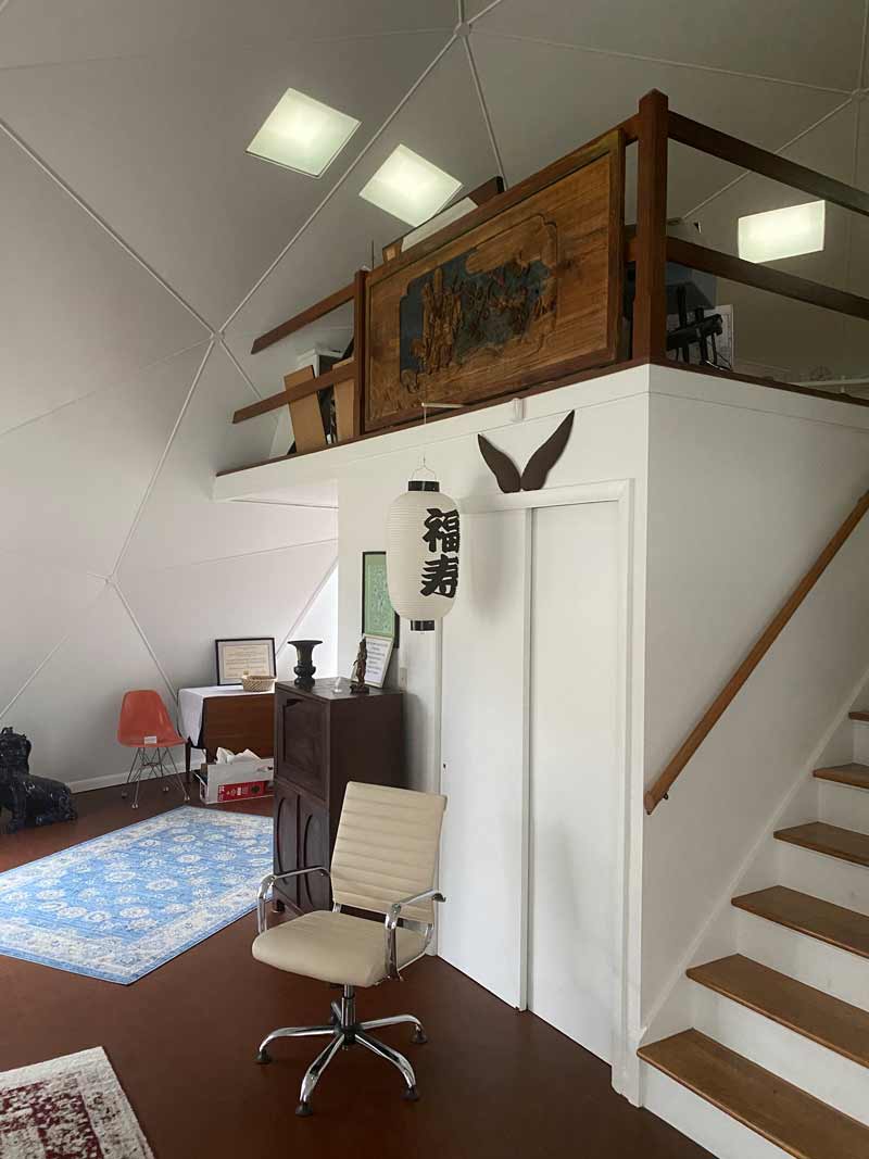 Woodcut and lantern in finished Buckey Fuller Home Dome Carbondale