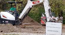 Backhoe digging trench for foundations